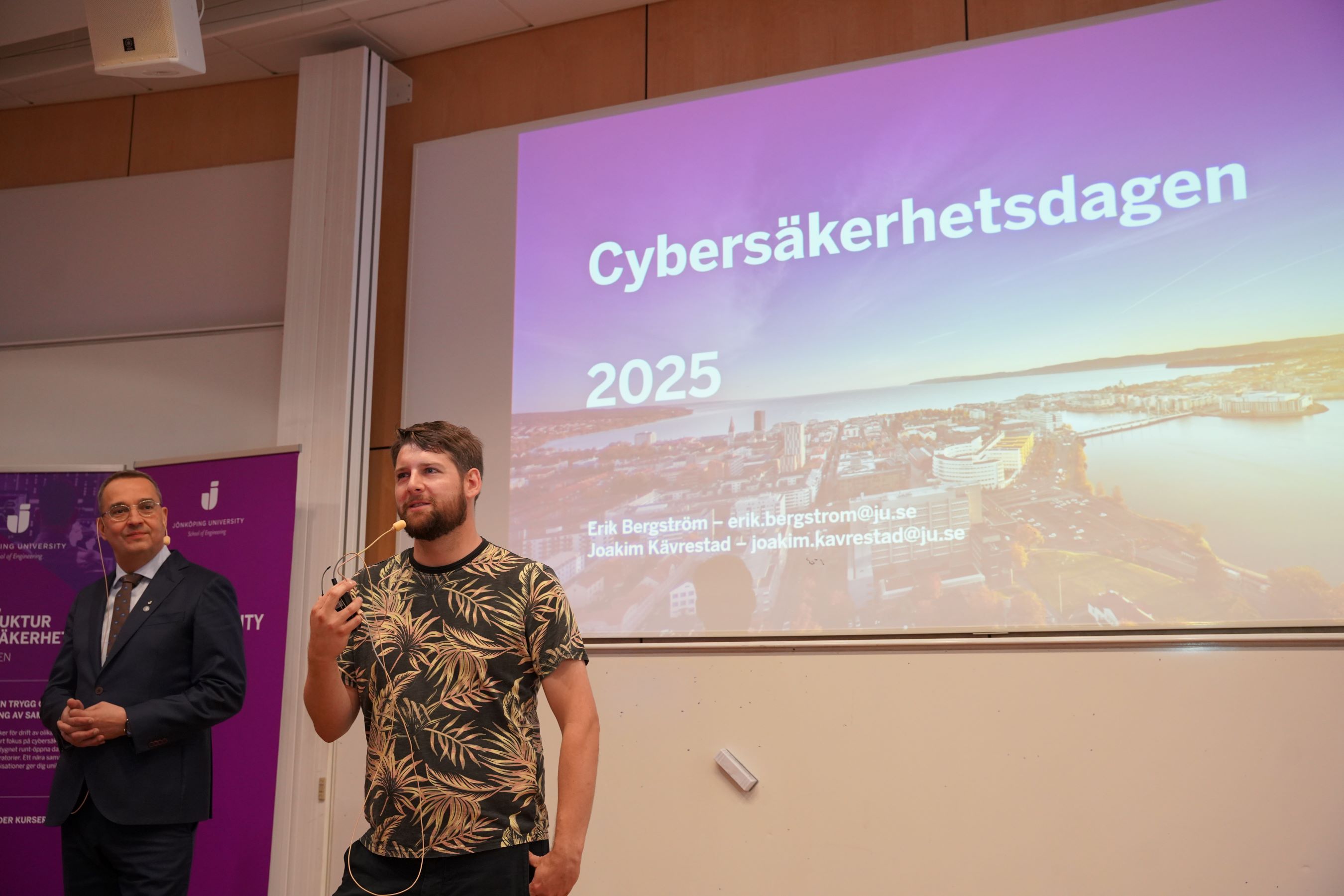 Two men talking to a crowd.